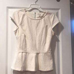 Cream-colored peplum top